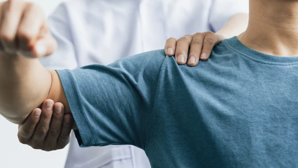 A patient receiving an arm exam.