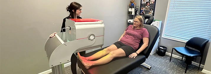 Laser therapy patient receiving foot care.
