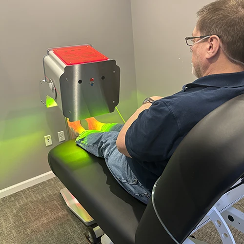 Laser therapy on a patients feet.