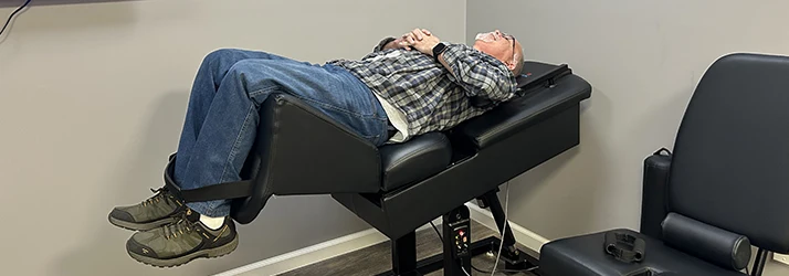 Chiropractic West St. Louis MO Spinal Decompression Patient A spinal decompression patient on a decompression table.