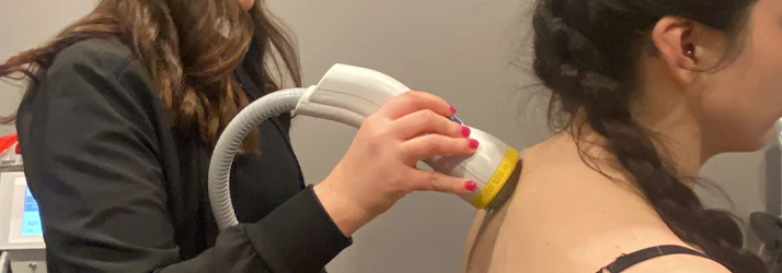 Chiropractor Jessica Ferguson with a SoftWave patient.
