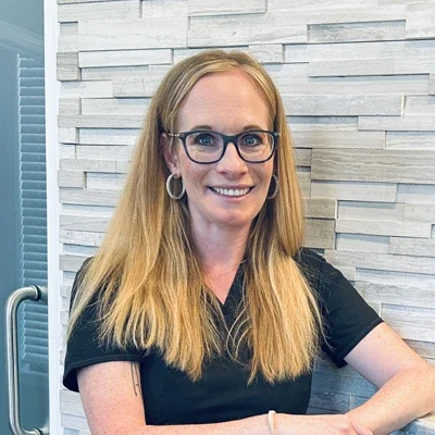 A headshot photo of Chelby, a front desk coordinator